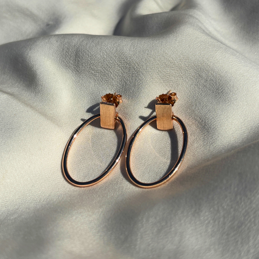 Sculpted Oval Hoop Earrings in Sterling Silver with a Touch of Rose Gold Plating