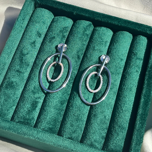 Hand-Crafted Sterling Silver Oval Hoop Earrings with a Centered Cubic Zirconia Band